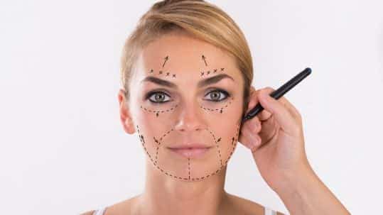 Sydney plastic surgeon mapping a facelift surgery on a patient